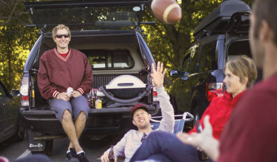 group of guys tailgating